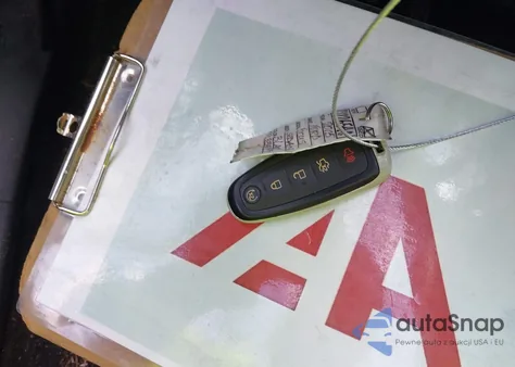 2015 Ford Focus Titanium z USA, uszkodzony, nr VIN 1FADP3J25FL338697